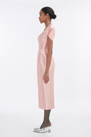 Soft pink orchid sculpted-sleeve pegged midi dress by Tiny Ink, shown on a mannequin with a fitted silhouette and elegant design.