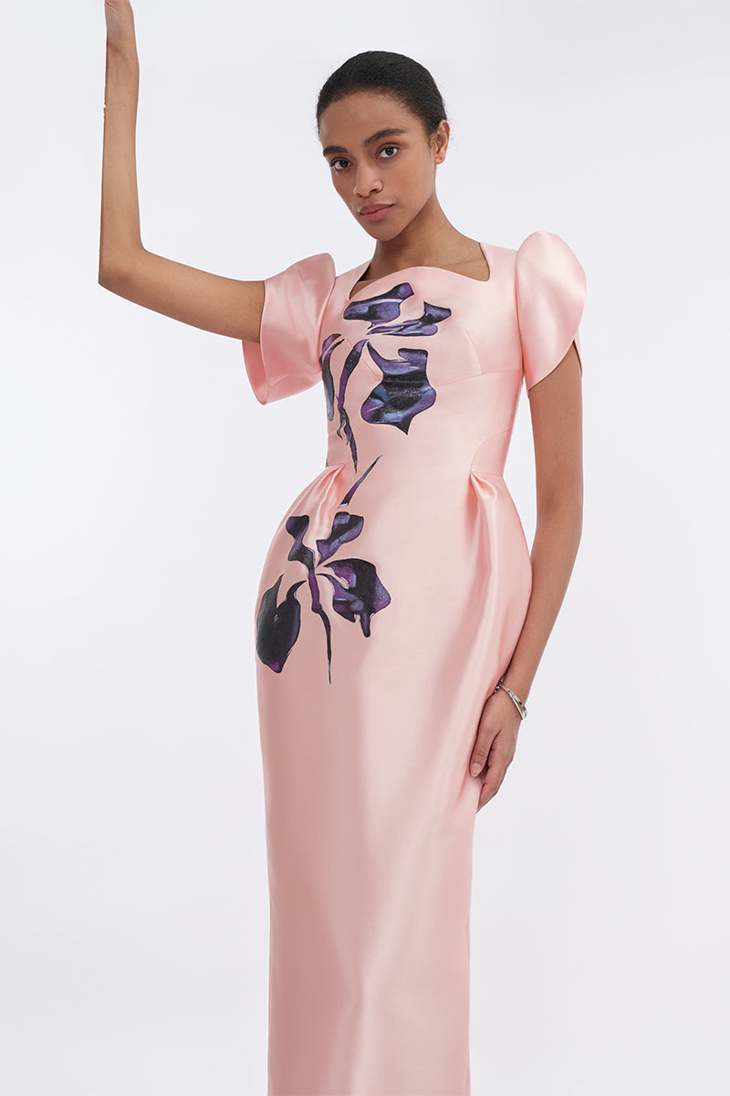 Soft pink orchid midi dress with sculpted sleeves and pegged design by Tiny Ink, displayed on a hanger.