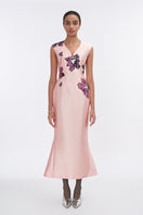 Soft pink orchid V-neck mermaid maxi dress by Tiny Ink, flowing fabric with a fitted silhouette and elegant design.