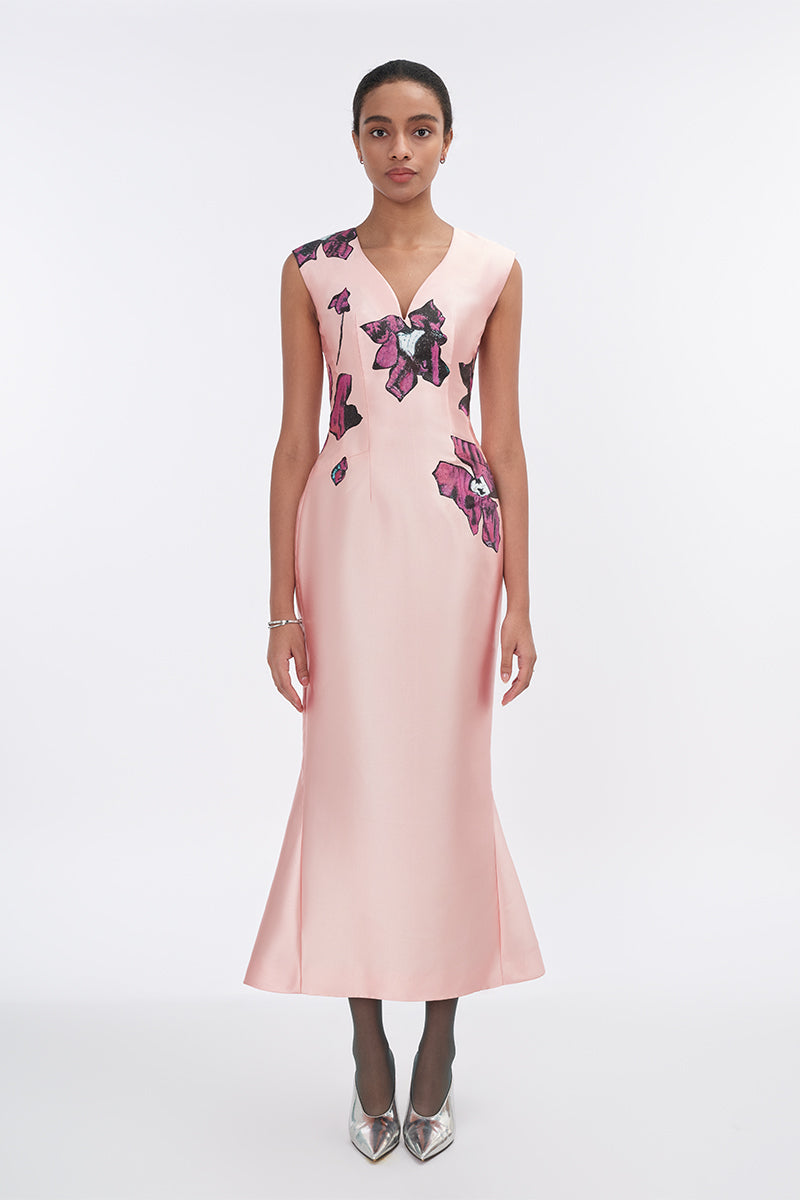 Soft pink orchid V-neck mermaid maxi dress by Tiny Ink, flowing fabric with a fitted silhouette and elegant design.