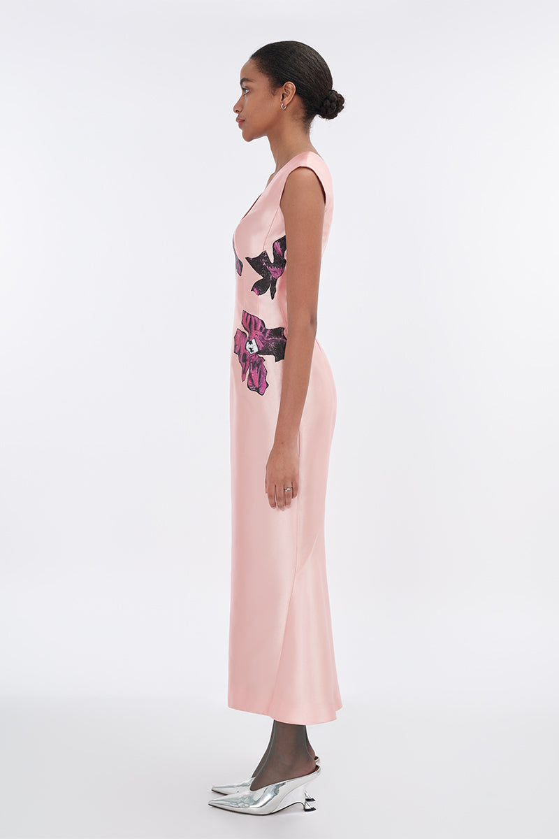 Soft pink orchid V-neck mermaid maxi dress by Tiny Ink, flowing fabric with fitted silhouette and elegant design.