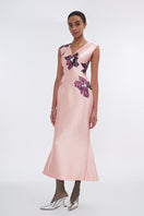 Soft pink orchid V-neck mermaid maxi dress by Tiny Ink, flowing fabric and elegant design, displayed on a model.
