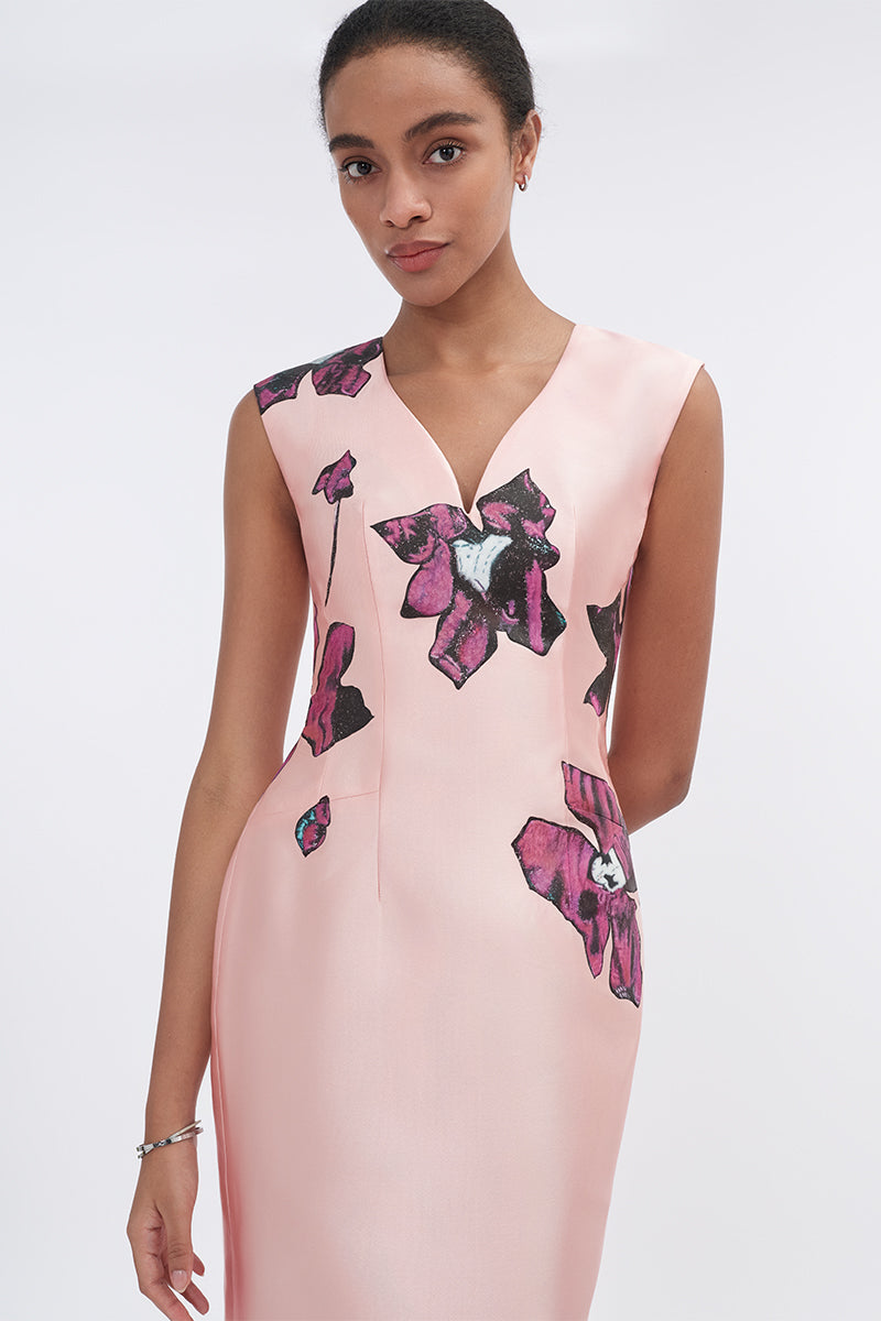 Soft pink orchid V-neck mermaid maxi dress by Tiny Ink, featuring a fitted bodice and flowing skirt, perfect for elegant occasions.