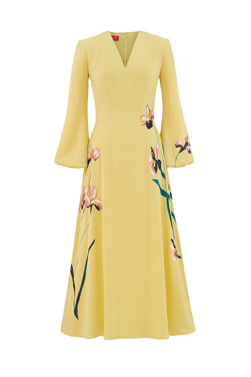 Soft yellow bishop sleeve flared midi dress by Tiny Ink, featuring a flowy silhouette and elegant design.