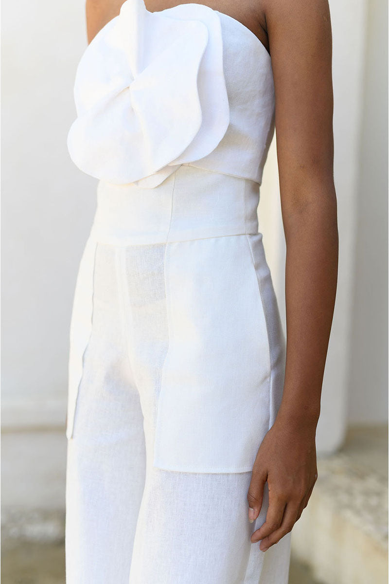 Off-white ANA + MARIA SOLE PANTS with a relaxed fit, shown in a front view on a model.