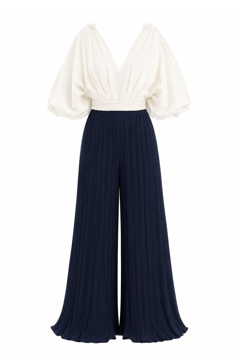 Navy and white Sombra Palma jumpsuit by Maylé Vásquez, featuring a stylish, fitted design with short sleeves and a V-neck.