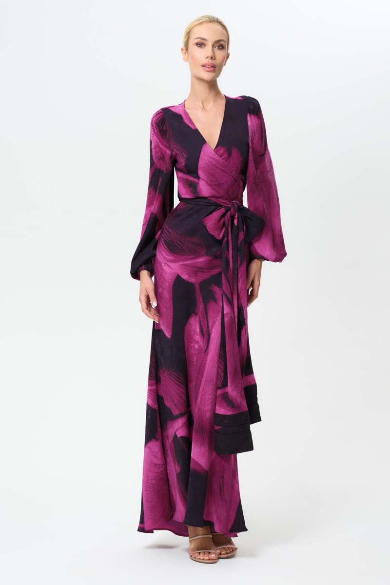 NiLuu Sophia Maia wrap top featuring a stylish, fitted design with long sleeves and a V-neck, shown in a neutral fabric.