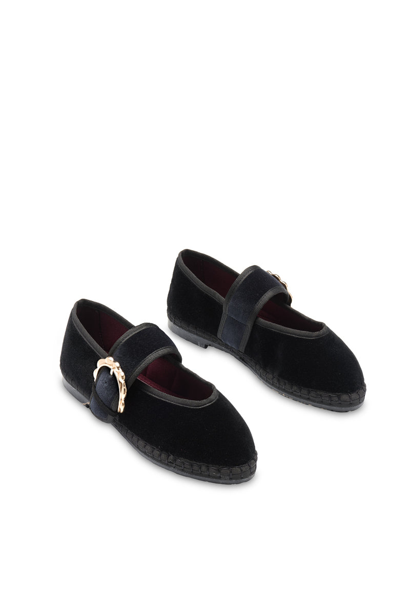Flabelus Sophie black flats with black piping and buckle closure, showcasing the stylish slip-on footwear.