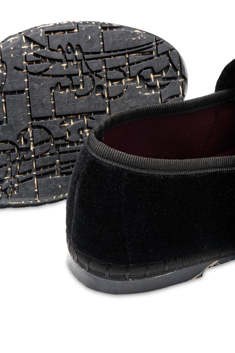 Flabelus Sophie black flats with black piping and buckle closure, featuring a sleek design and comfortable slip-on style.
