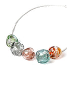 Multicolor SOPLO Necklace by SALVÁREA featuring layered design and vibrant beads on a delicate chain.
