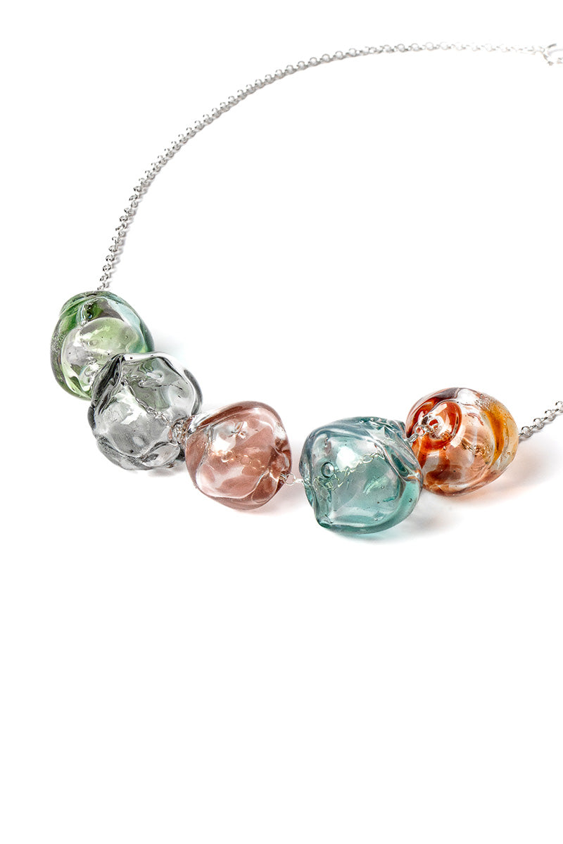 Multicolor SOPLO Necklace by SALVÁREA featuring layered design and vibrant beads on a delicate chain.
