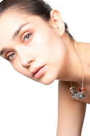 Multicolor SALVÁREA Soplo Necklace with layered chain design, featuring vibrant beads and intricate details.