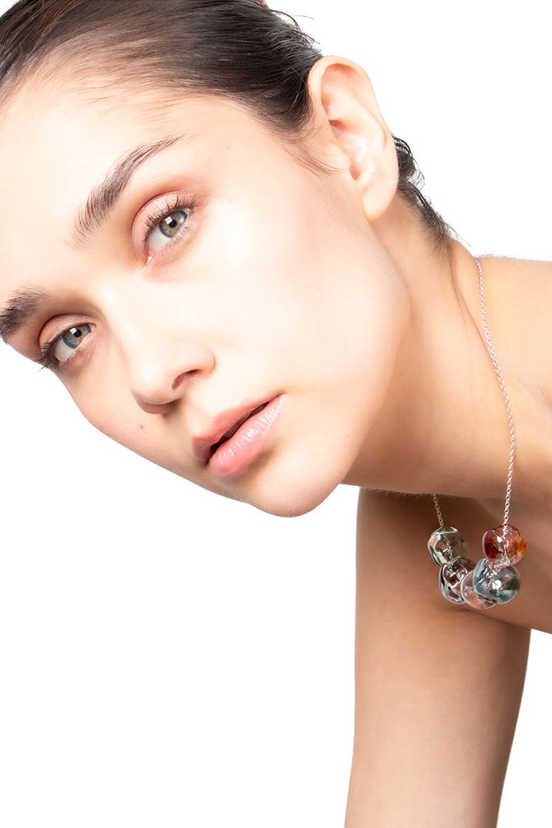 Multicolor SALVÁREA Soplo Necklace with layered chain design, featuring vibrant beads and intricate details.