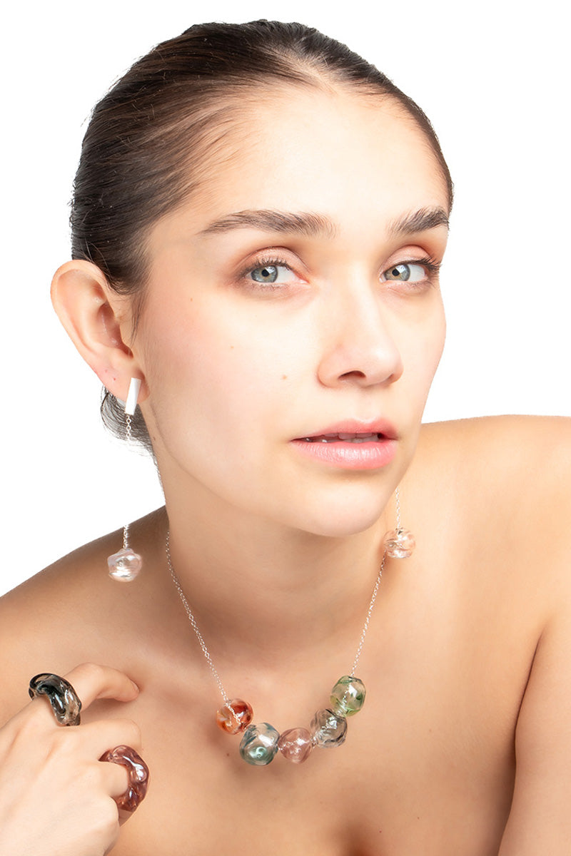 Colorful multicolor SOPLO necklace by SALVÁREA featuring layered chain design with vibrant beads and mixed textures.