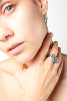 Salvárea Soplo Ring Set featuring multiple blue rings with intricate designs, stylish jewelry for everyday wear.