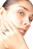 Salvárea Soplo Ring Set featuring multiple blue rings with intricate designs, displayed on a neutral background.