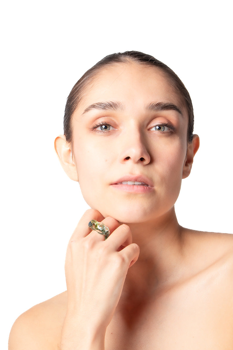 Salvárea Soplo ring set featuring three green and silver rings with intricate designs, displayed together on a white background.