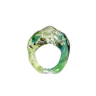 Salvárea Soplo ring set featuring green rings with intricate designs, showcasing multiple stylish rings on a white background.