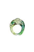 Salvárea Soplo ring set featuring green rings with intricate designs, showcasing multiple stylish rings on a white background.