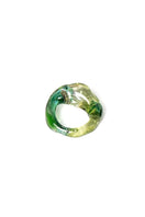 Green SALVÁREA SOPLO RING SET featuring multiple rings with intricate designs and a vibrant green finish.