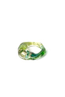 Salvárea Soplo Ring Set featuring elegant green rings with intricate designs, showcasing a stylish and modern jewelry collection.