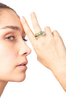 Salvárea Soplo Ring Set featuring green rings with intricate designs, perfect for stylish layered jewelry looks.