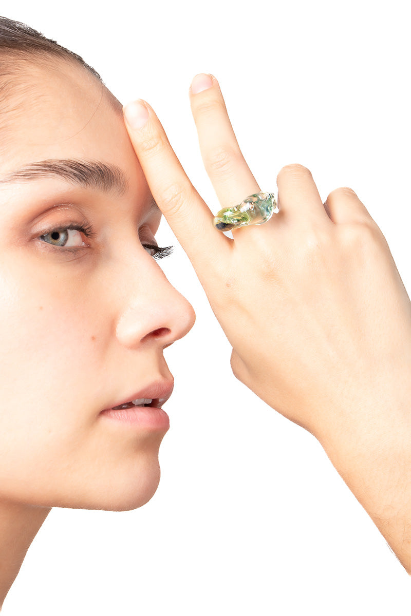 Salvárea Soplo Ring Set featuring green rings with intricate designs, perfect for stylish layered jewelry looks.
