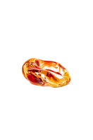 Salvárea Soplo Ring Set featuring vibrant red rings with intricate designs, perfect for stylish jewelry collection.