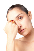 Red SALVÁREA SOPLO ring set featuring multiple stylish rings on a white background.