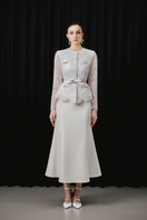 White Plan SOVEN top and NOVEN skirt co-ord set, featuring a stylish matching outfit with a fitted top and flowing skirt.