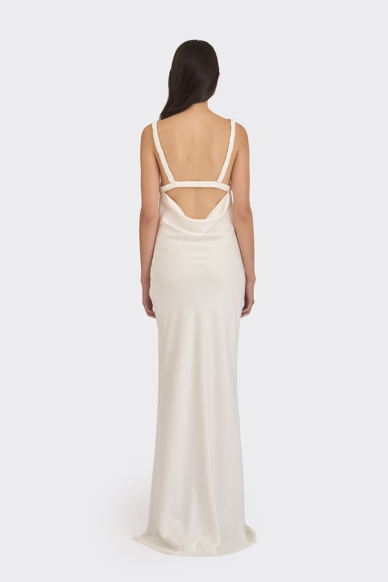 White spiral cowl maxi dress by Stolen Stores, featuring a flowing design with a cowl neckline and elegant silhouette.