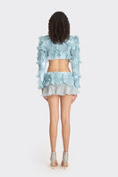 Blue lotus leaf bolero jacket by Stolen Stores, featuring spiral leaf pattern and lightweight design.