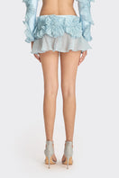 Blue lotus leaf-inspired mini skirt by Stolen Stores, featuring a spiral leaf design and stylish fit.
