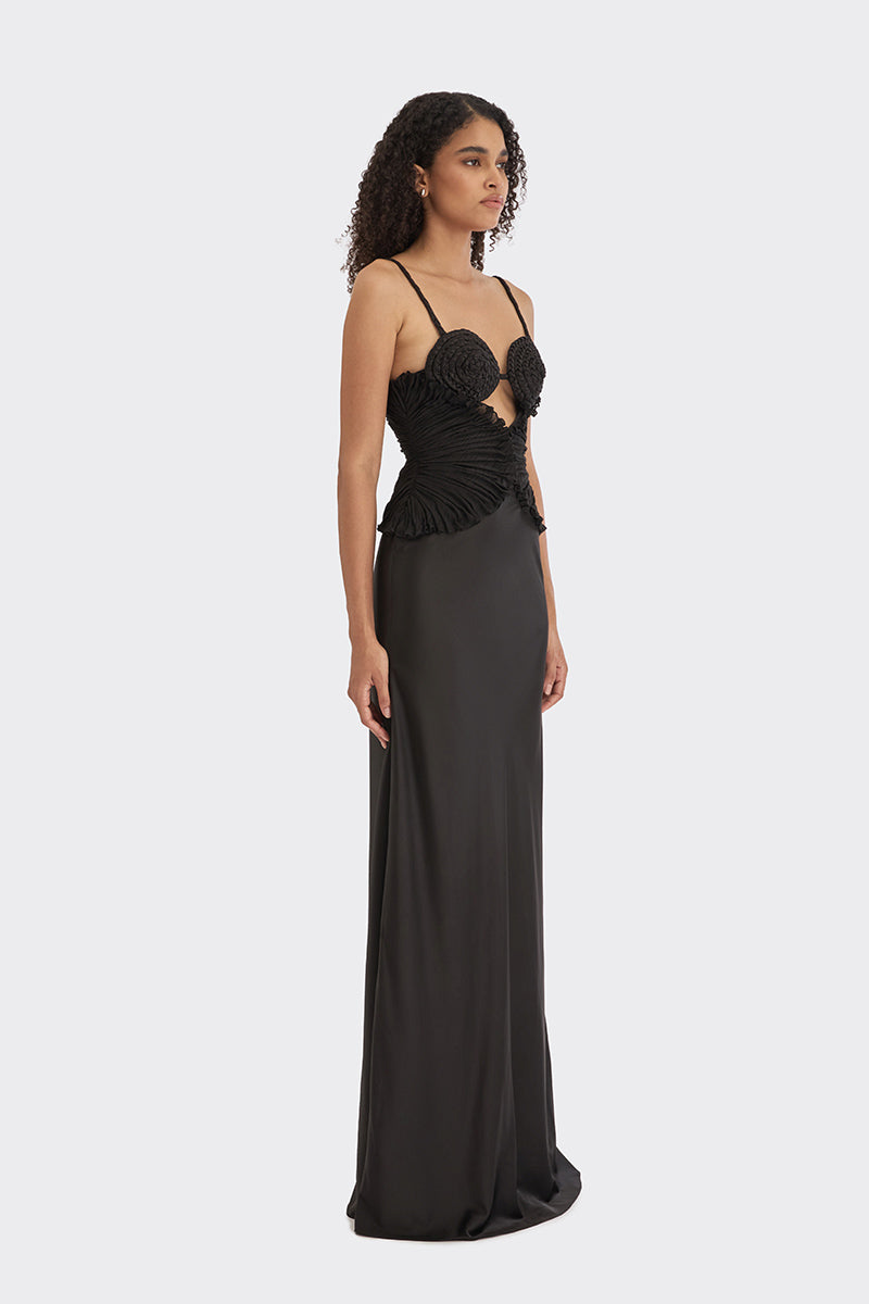 Black spiral lotus leaf maxi dress from Stolen Stores, featuring flowing fabric and elegant design.