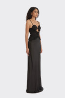 Black spiral lotus leaf maxi dress by Stolen Stores displayed on a model, featuring flowing fabric and elegant design.