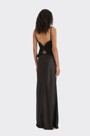 Black spiral lotus leaf maxi dress by Stolen Stores, flowing fabric with a spiral leaf top design, perfect for elegant summer wear.