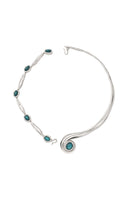 Rhodium-plated spiral necklace by Jude Benhalim featuring an interchangeable blue pendant on a sleek chain.