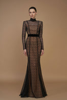 Black mermaid gown with stand collar, lace bodice, and velvet skirt by I.H.F, shown with long sleeves and elegant silhouette.