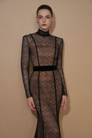 Elegant black gown by I.H.F featuring vine guipure lace and Lyon velvet with a stand collar and long sleeves, mermaid silhouette.