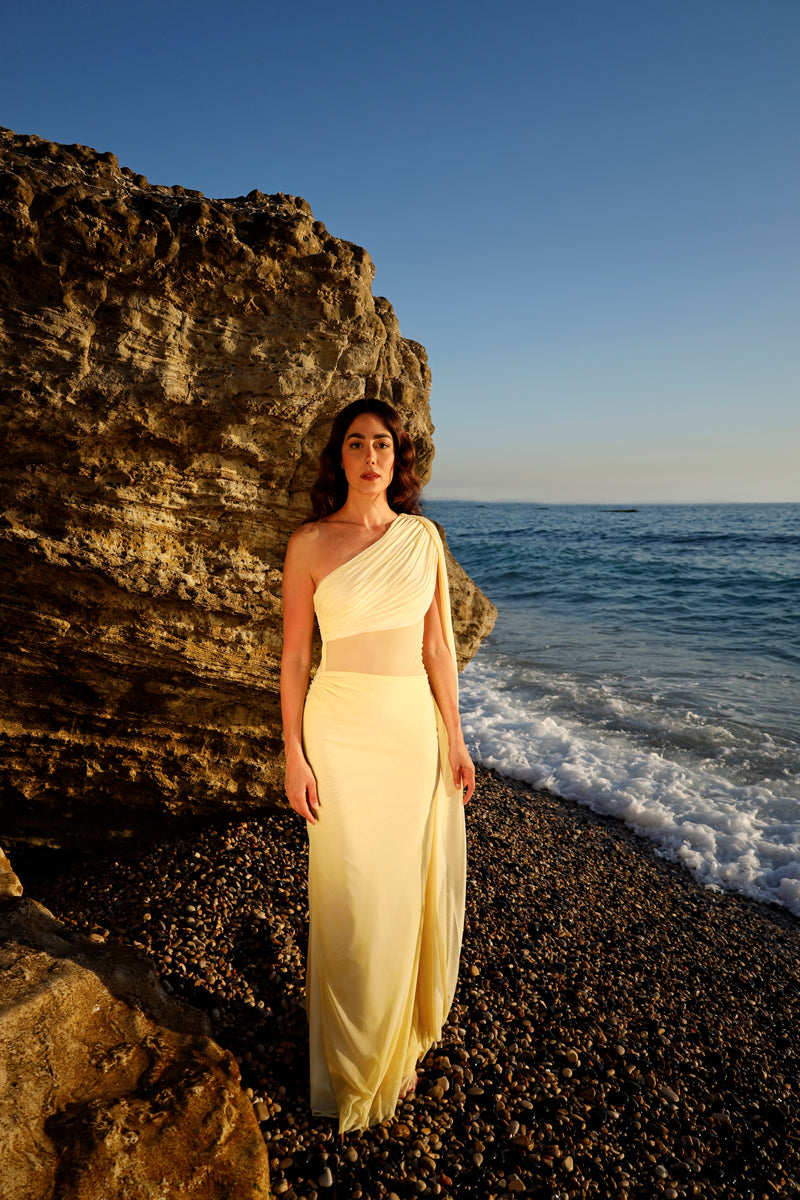 Rayane Bacha Stellamaris gown in butter yellow, elegant flowy dress with delicate fabric and stylish design.