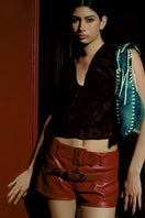 Red Sterling leather belted shorts by Double A, featuring a stylish belt and classic short design, perfect for casual wear.