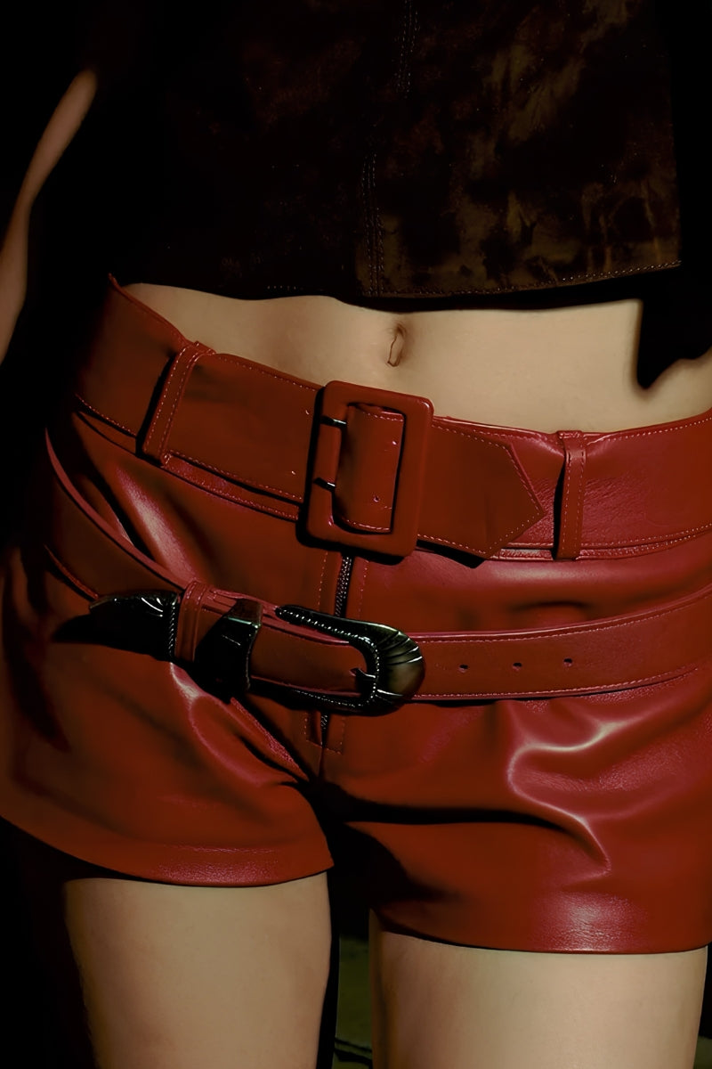 Red leather belted shorts by Double A featuring a stylish sterling leather belt and tailored fit.