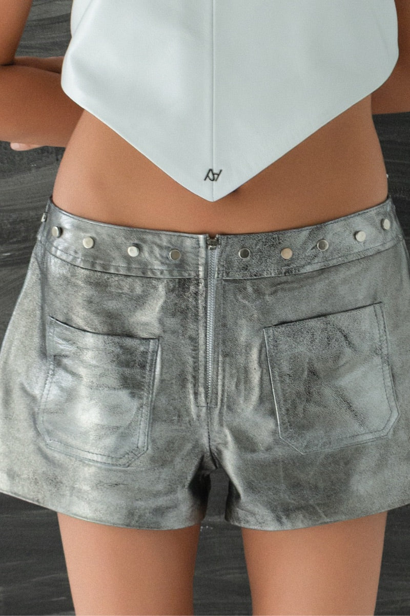 Double A Sterling leather shorts in washed silver with a sleek, fitted design and distressed finish, displayed on a neutral background.