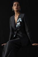 Black Stillness Bloom jacket and mermaid skirt co-ords by Tiny Ink, featuring a stylish jacket and flowing skirt.