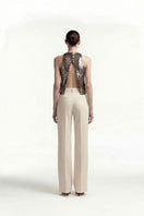 Beige straight-leg trousers by Tayfun Kaba, tailored pants with a classic fit, shown on a white background.
