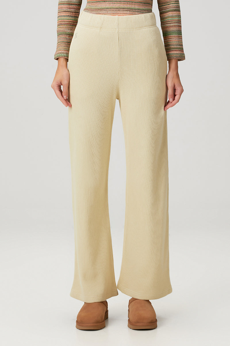 Yellow Bassigue straight leg sweatpants laid flat showing front view, soft fabric, and relaxed fit for comfortable casual wear.