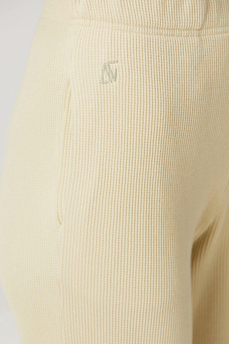 Yellow Bassigue straight leg sweatpants laid flat, showcasing the relaxed fit and soft fabric for comfortable casual wear.