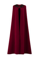 I.H.F ruby crepe and Lyon velvet gown featuring a strapless bustier, column silhouette, and elegant long cape.