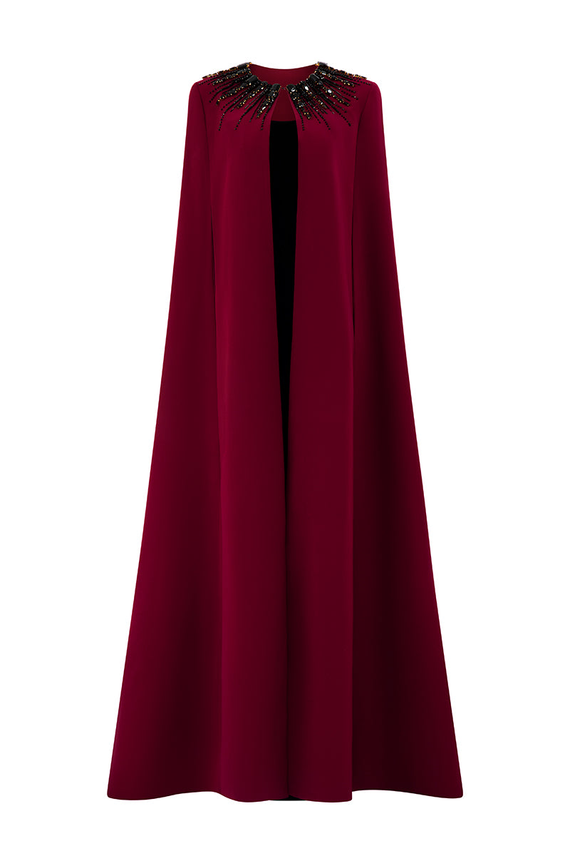 I.H.F ruby crepe and Lyon velvet gown featuring a strapless bustier, column silhouette, and elegant long cape.