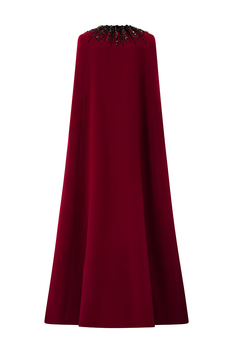 Elegant strapless ruby crepe and Lyon velvet gown with a long cape, designed by I.H.F, featuring a sleek column silhouette.